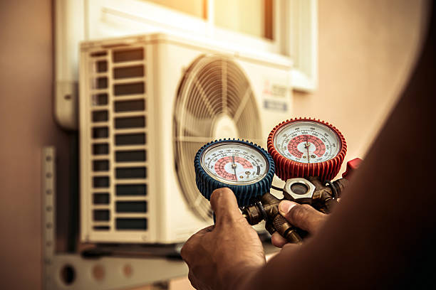 Professional Hvac technician working in Maxton, NC